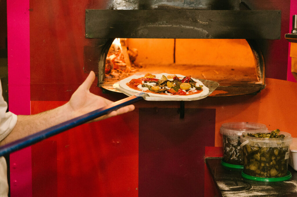 Woodfired oven in a pizza truck