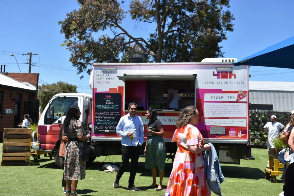 A pizza truck at a party